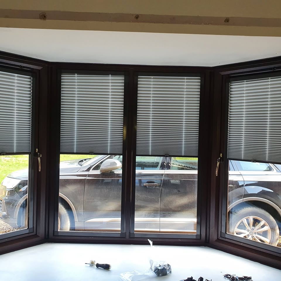 'Perfect-Fit' pleated blinds in a bay
